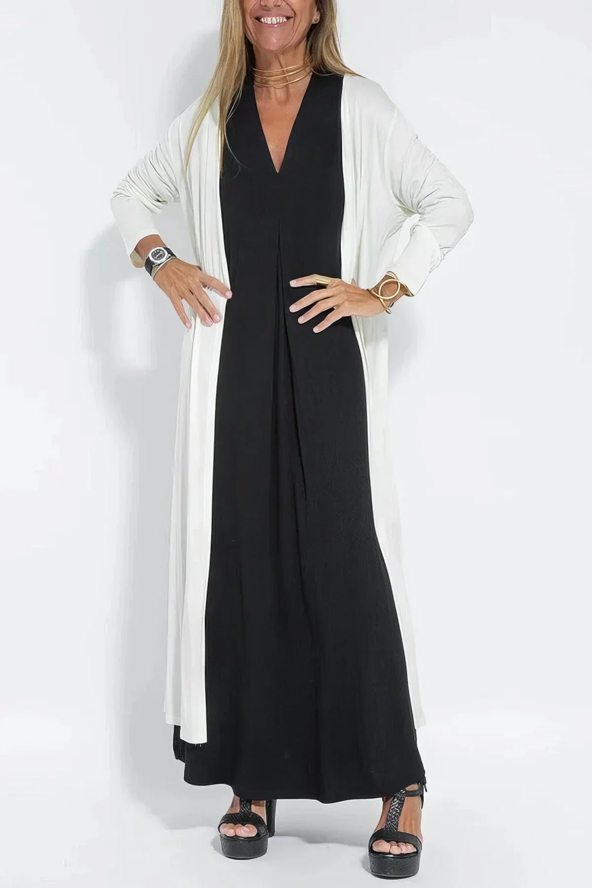 Women's knit flowy maxi dress with sleeveless V-neck and draped front