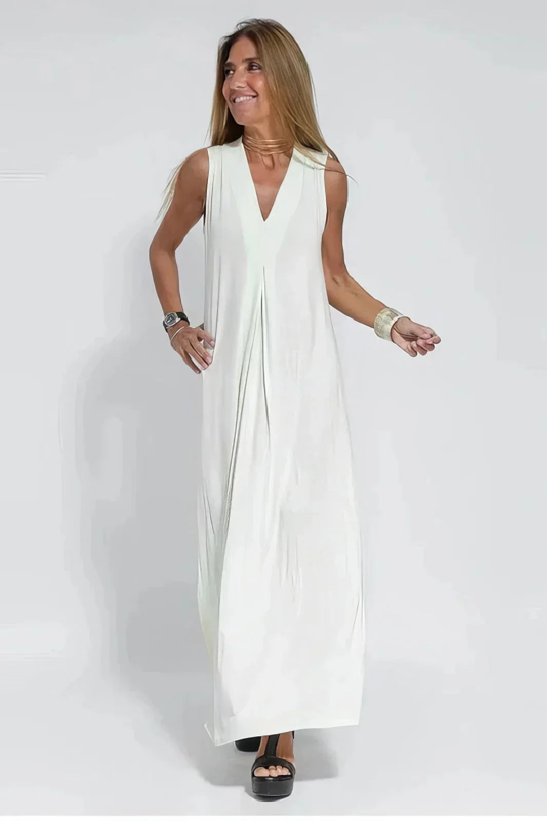 Women's knit flowy maxi dress with sleeveless V-neck and draped front